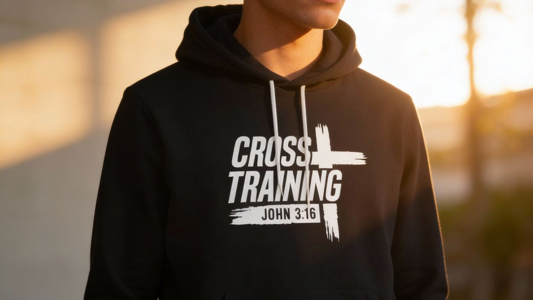 A person wears a black hoodie with "Cross Training John 3:16" printed on it.